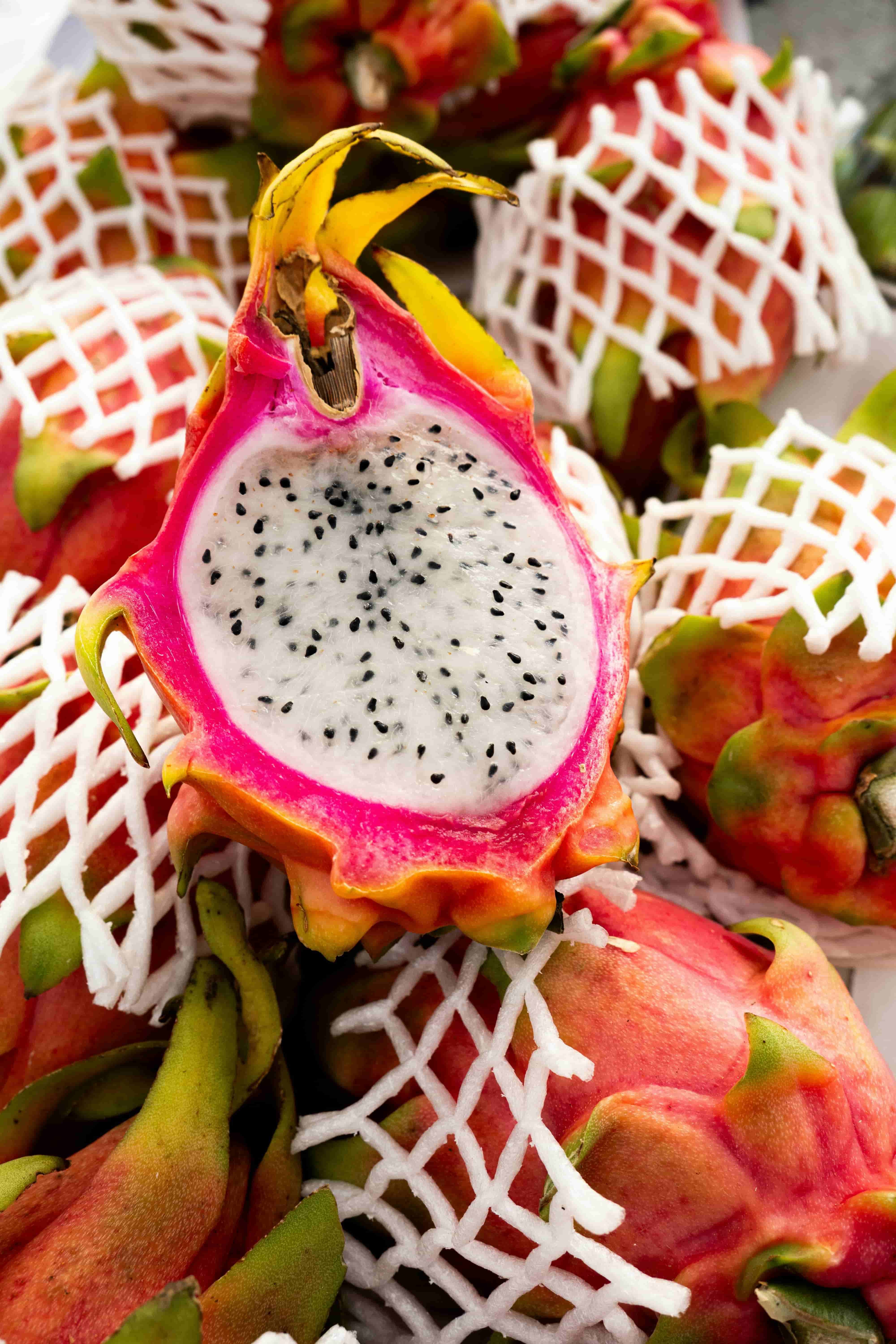 Vibrant dragon fruit with white and red flesh